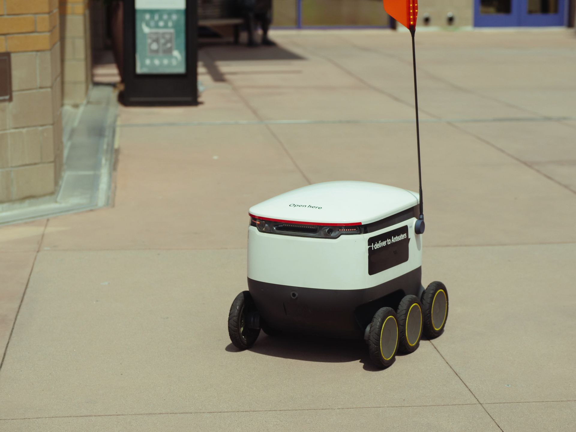 Mobile robot transporting materials in a facility