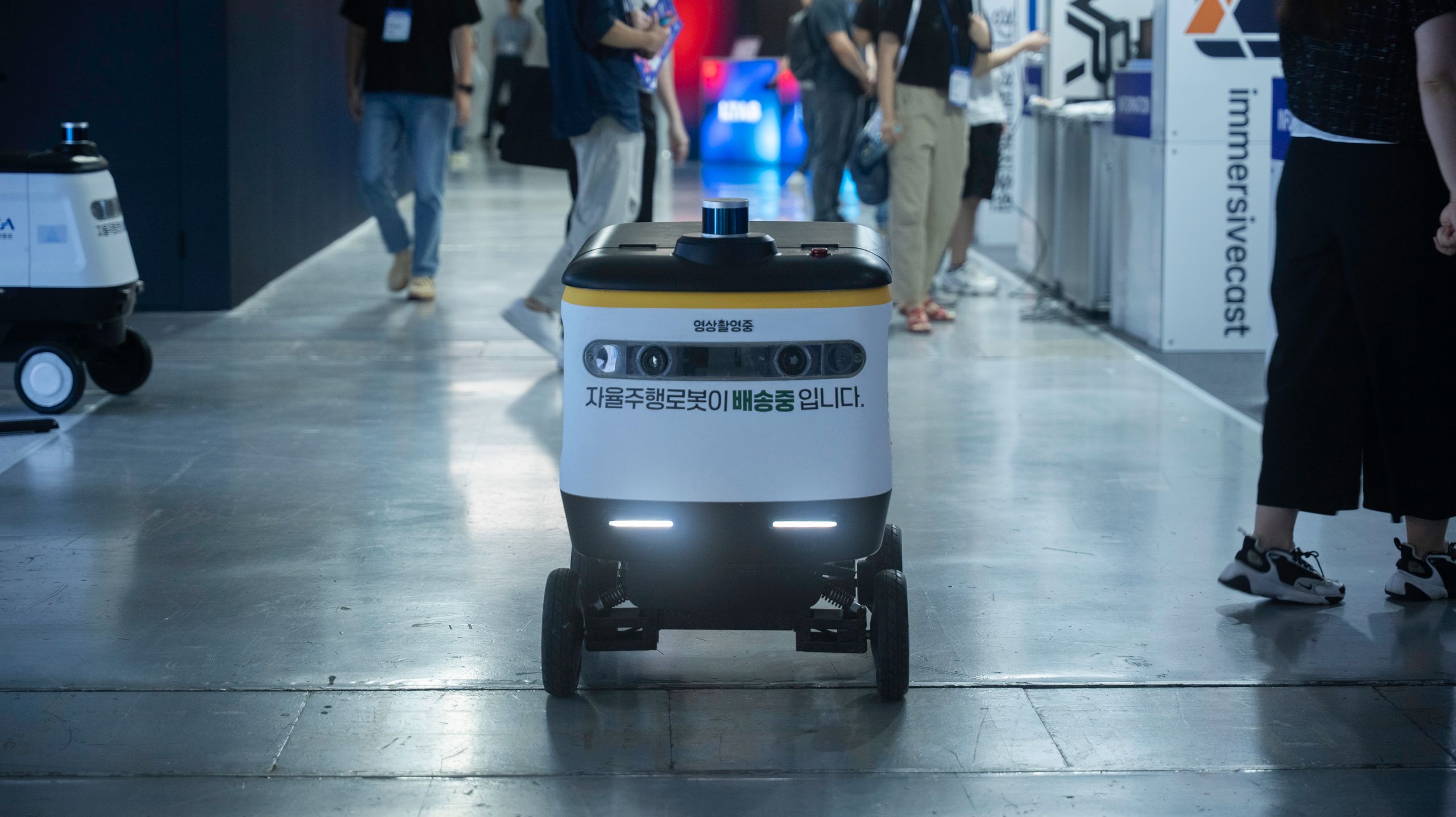 Single mobile robot being tested on a facility floor