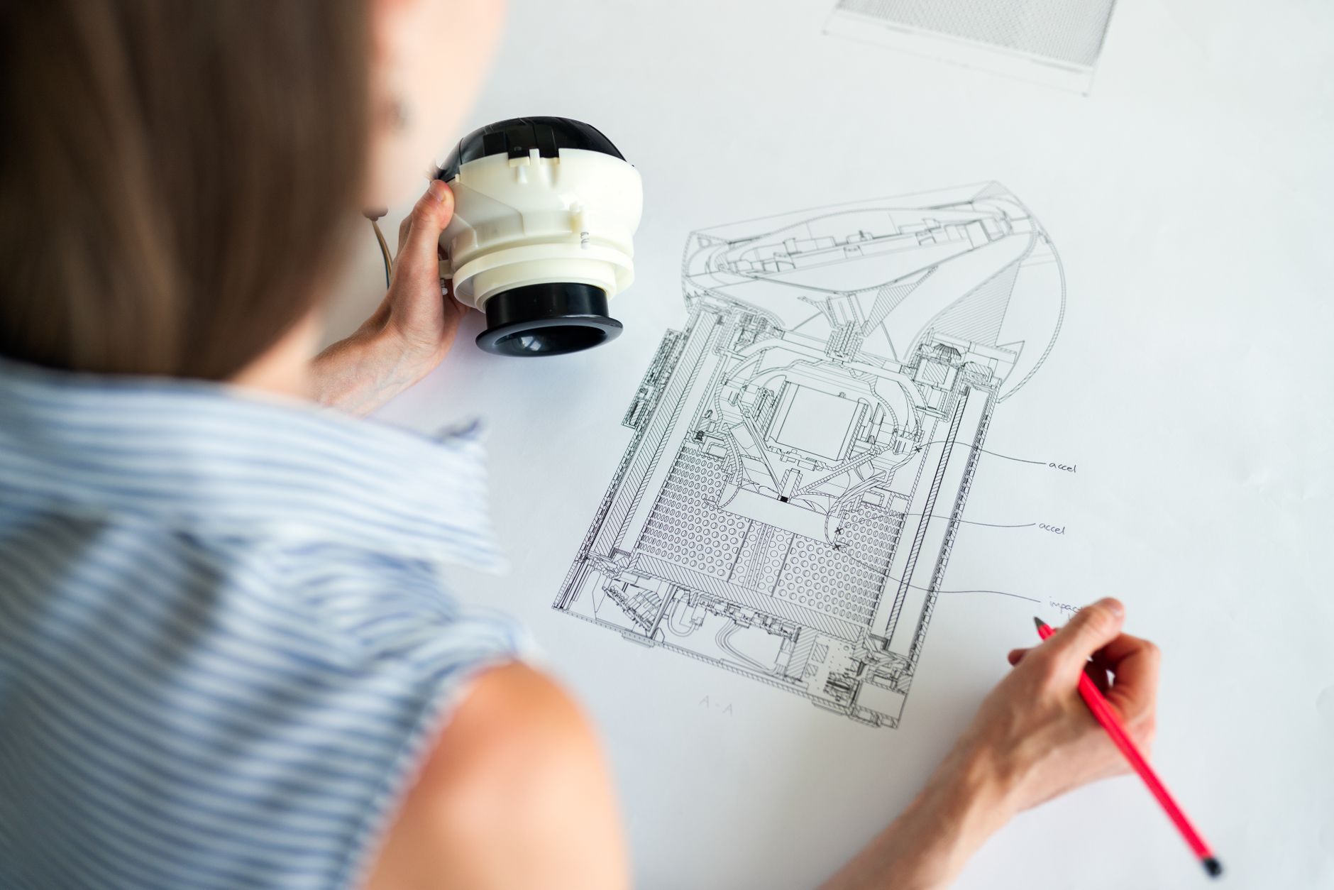 Engineer redesigning a part for easier disassembly and recycling