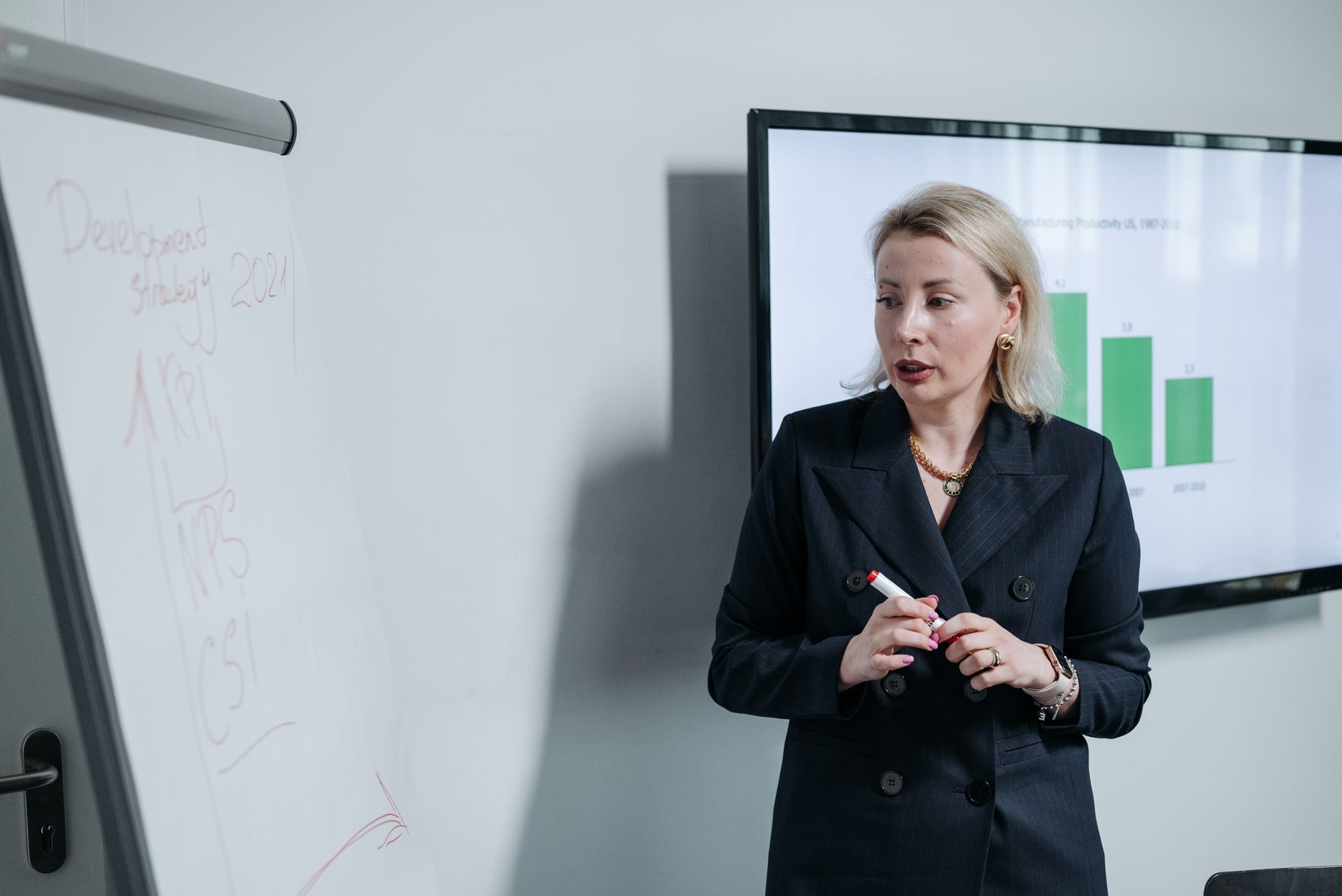 Consultant explaining a compliance roadmap to manufacturing leadership