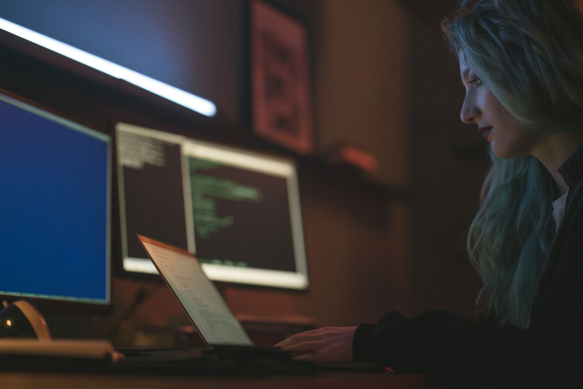 IT specialist reviewing cybersecurity controls on a monitor