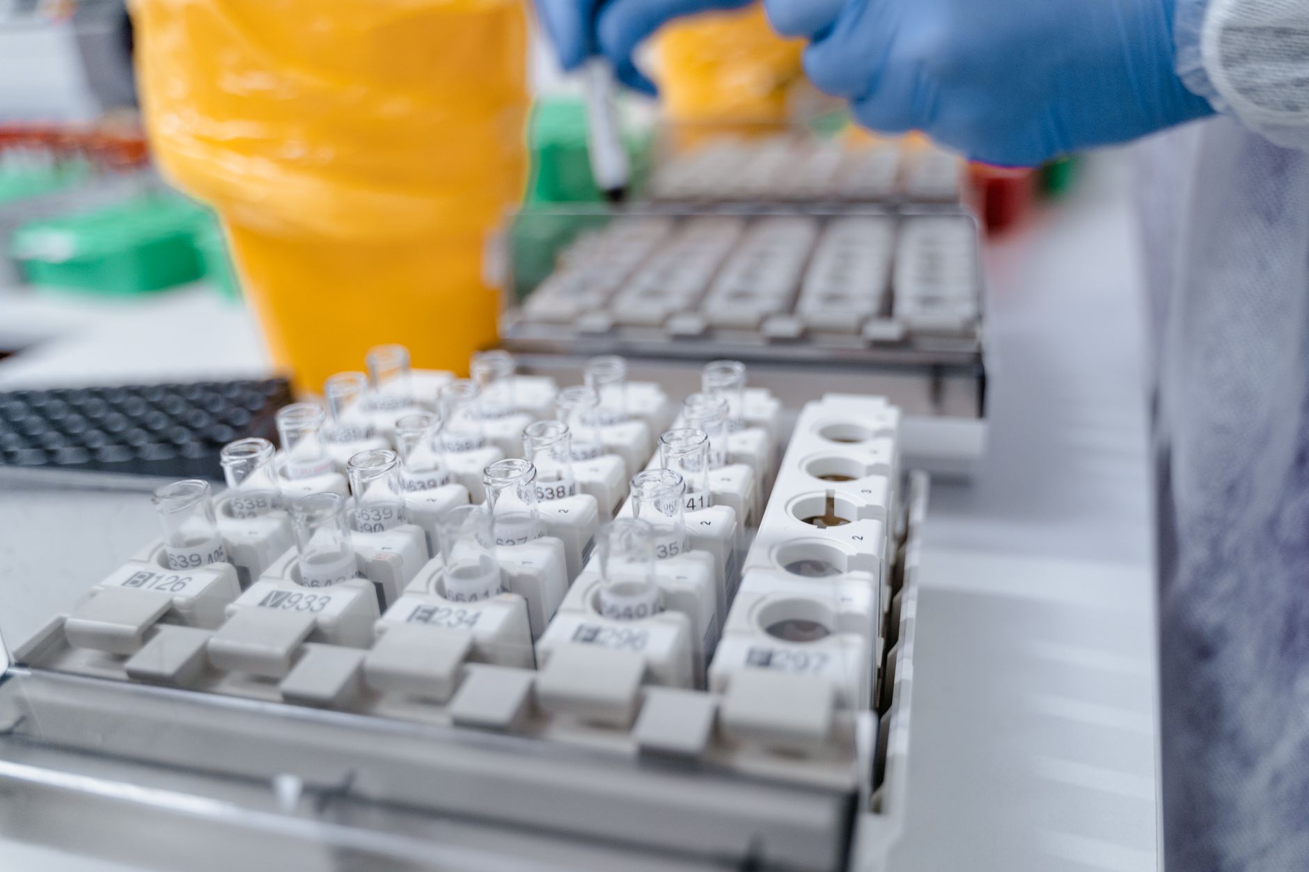 Technician testing a dust sample for combustibility