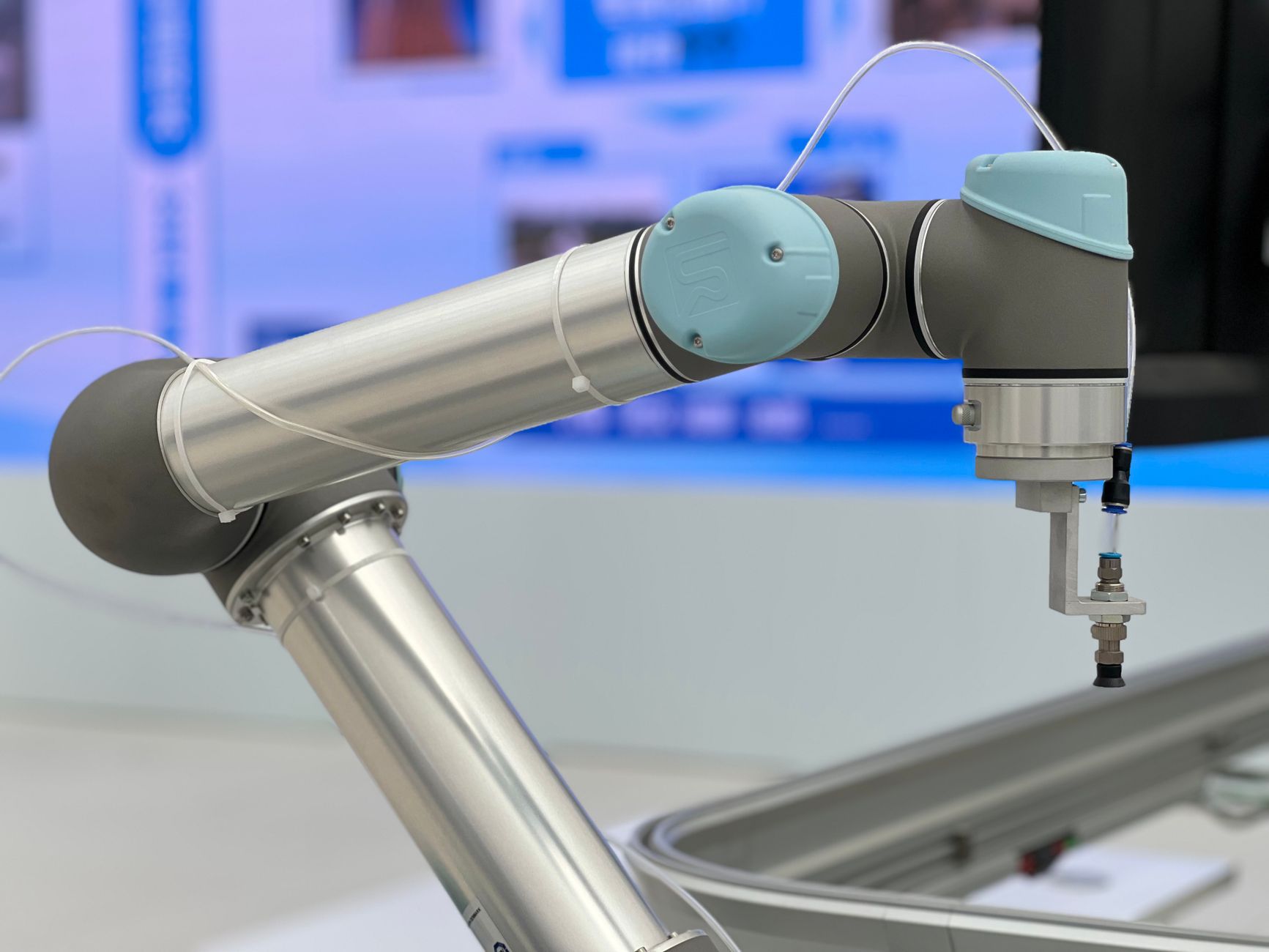 Engineer assessing pinch point hazards on a robotic gripper