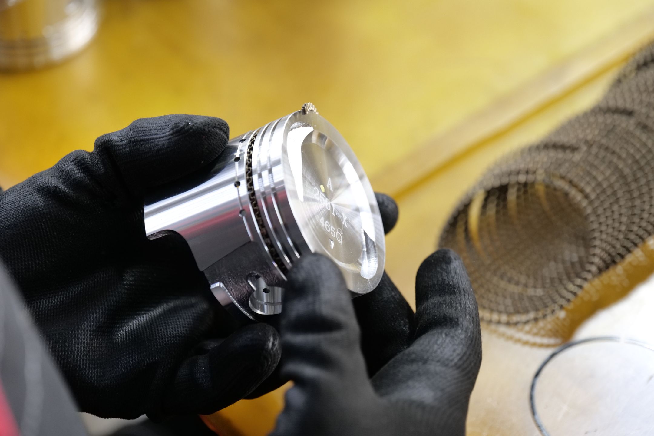Machinist inspecting a finished ground part