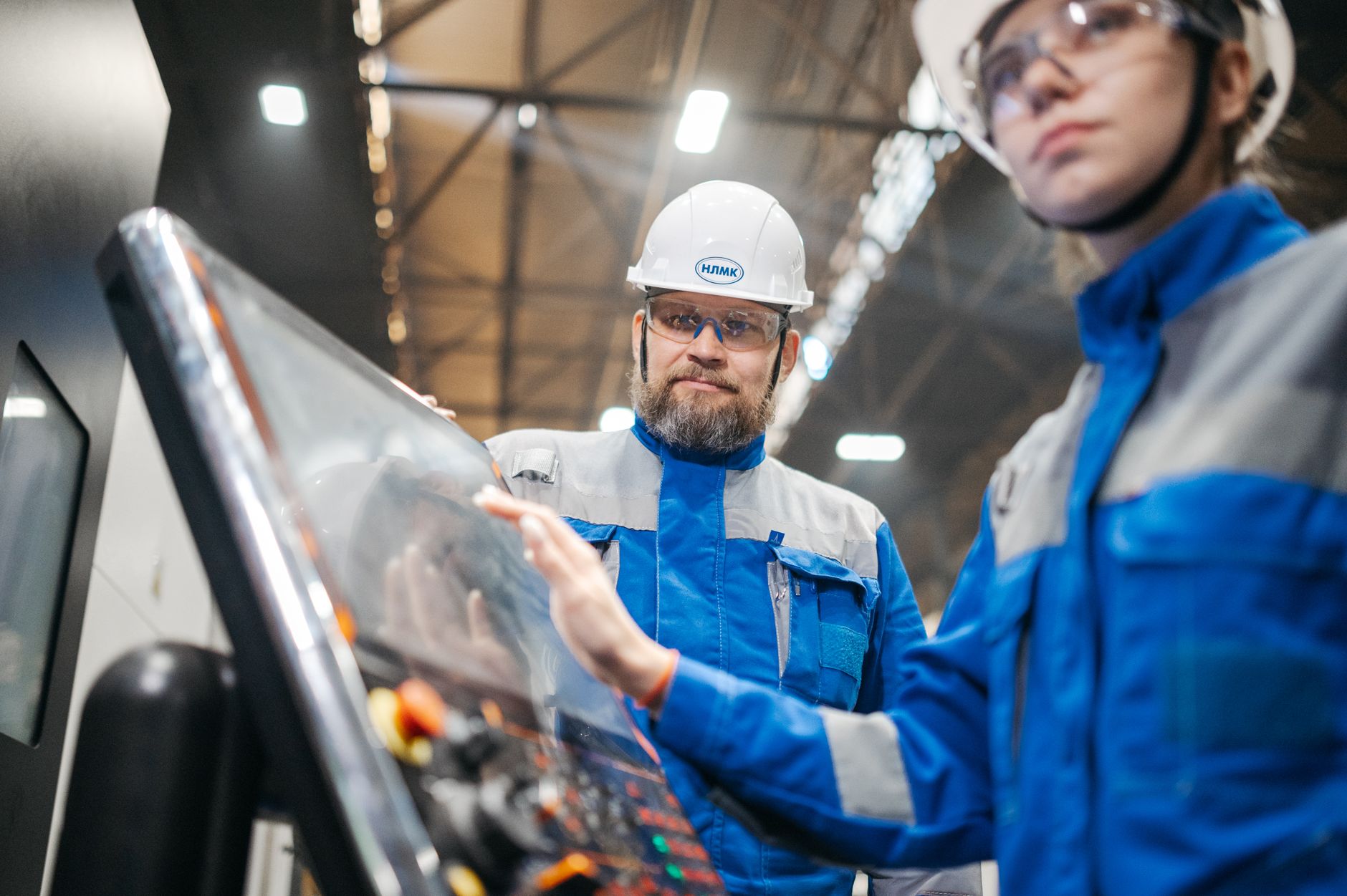 Operator interacting with a touchscreen HMI panel