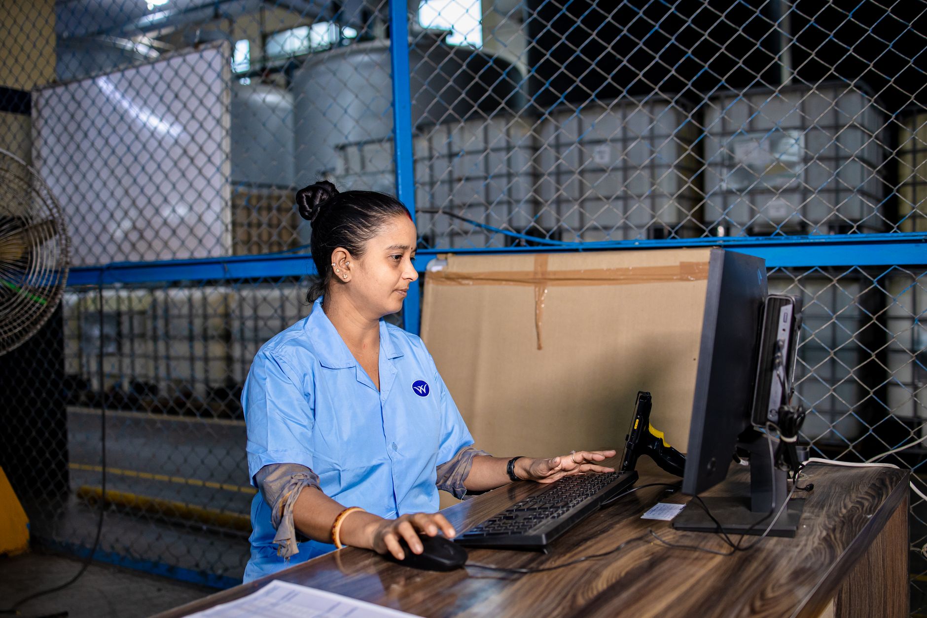 Engineer reviewing production execution data on a screen