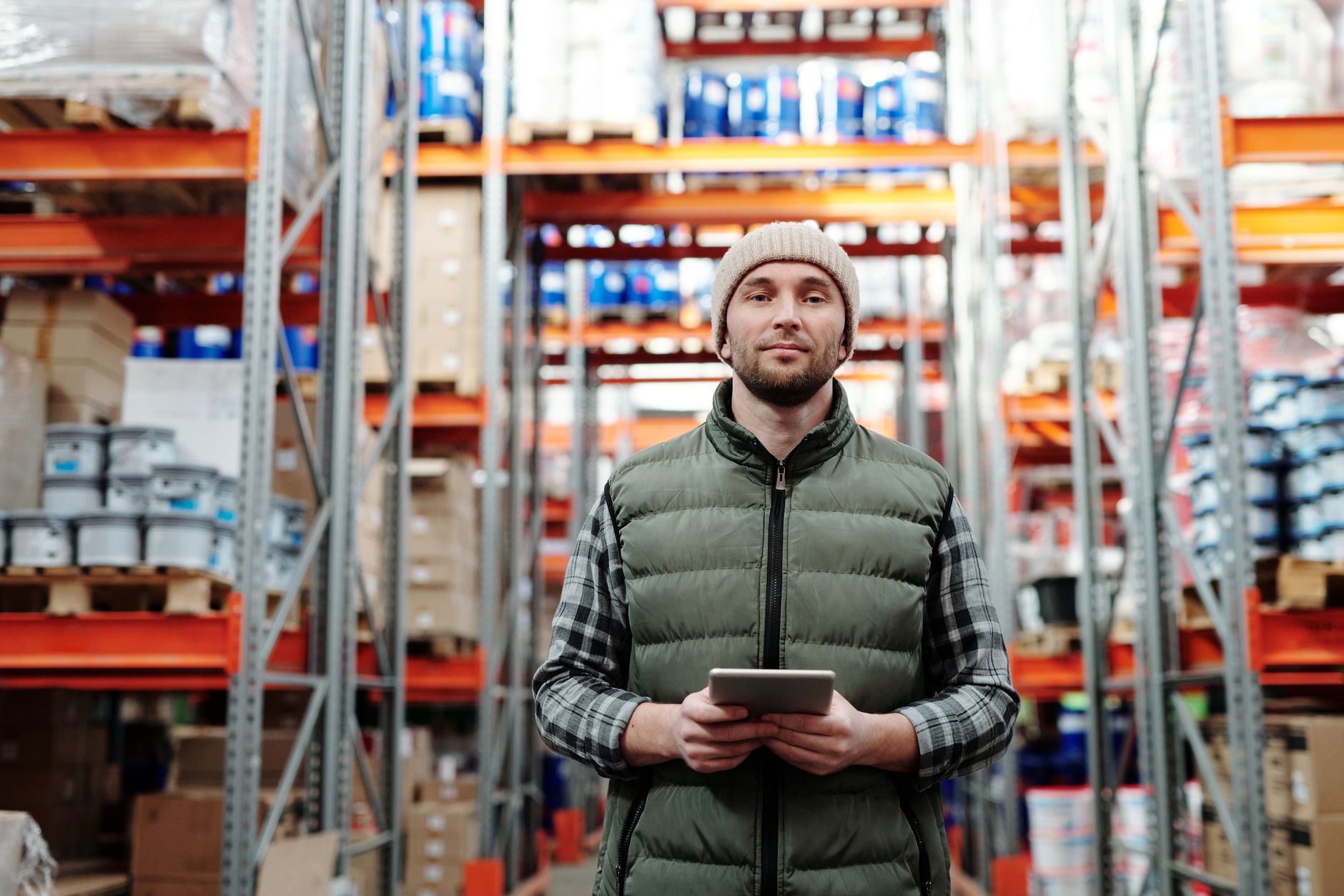 Factory manager reviewing production output on a tablet