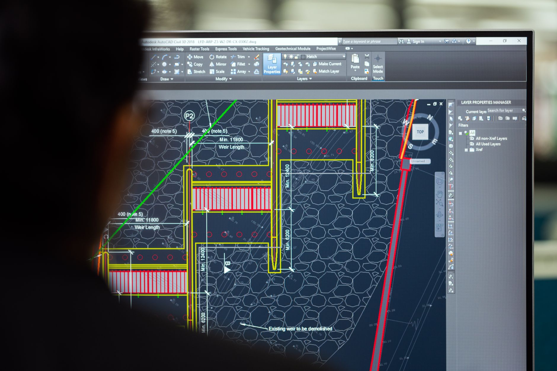 Engineer reviewing an OT network segmentation diagram