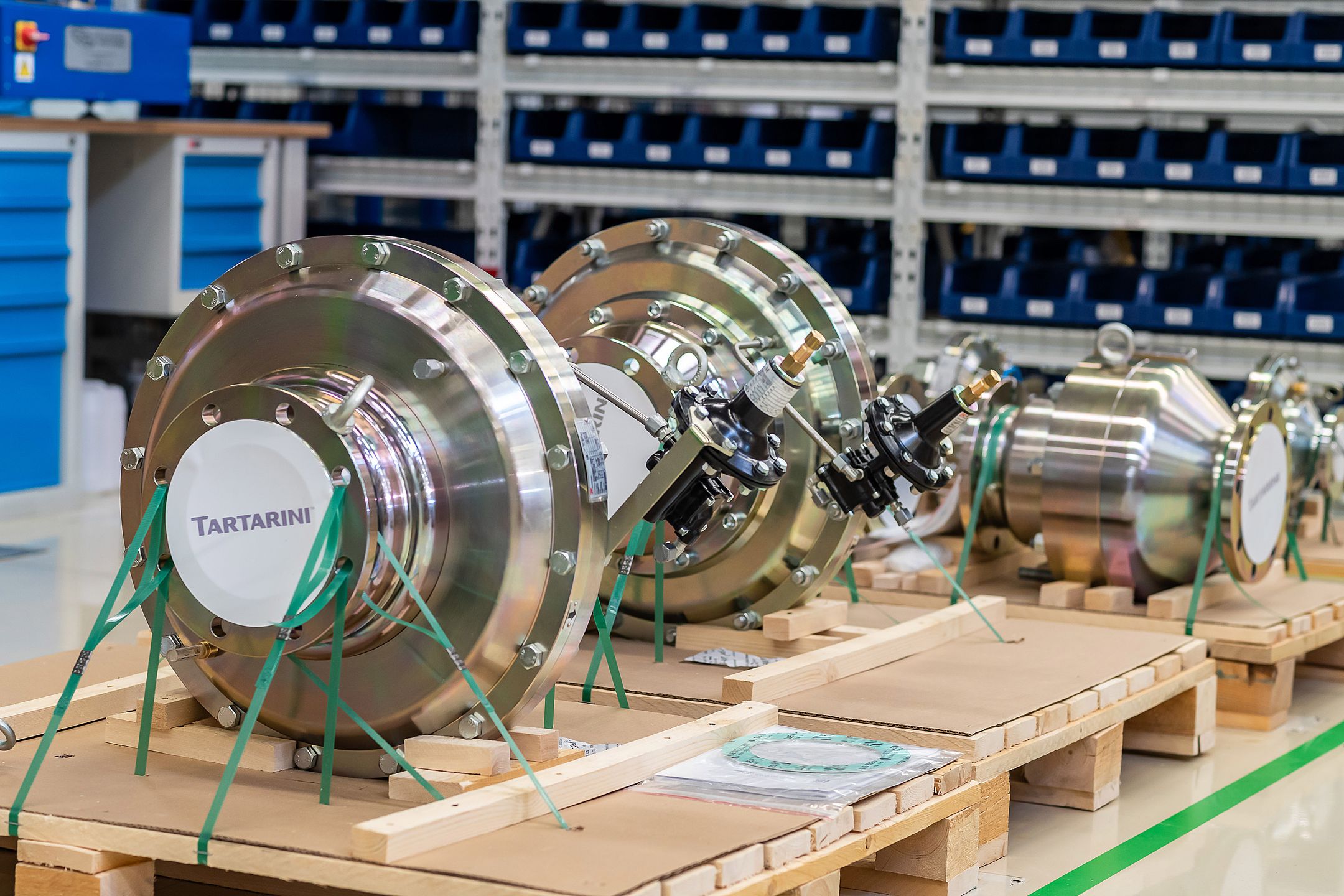 Large industrial valves stored in a workshop