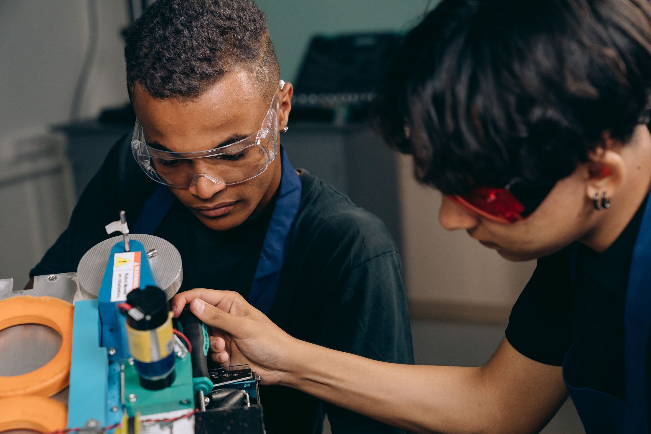 Two engineers collaborating on machinery operation