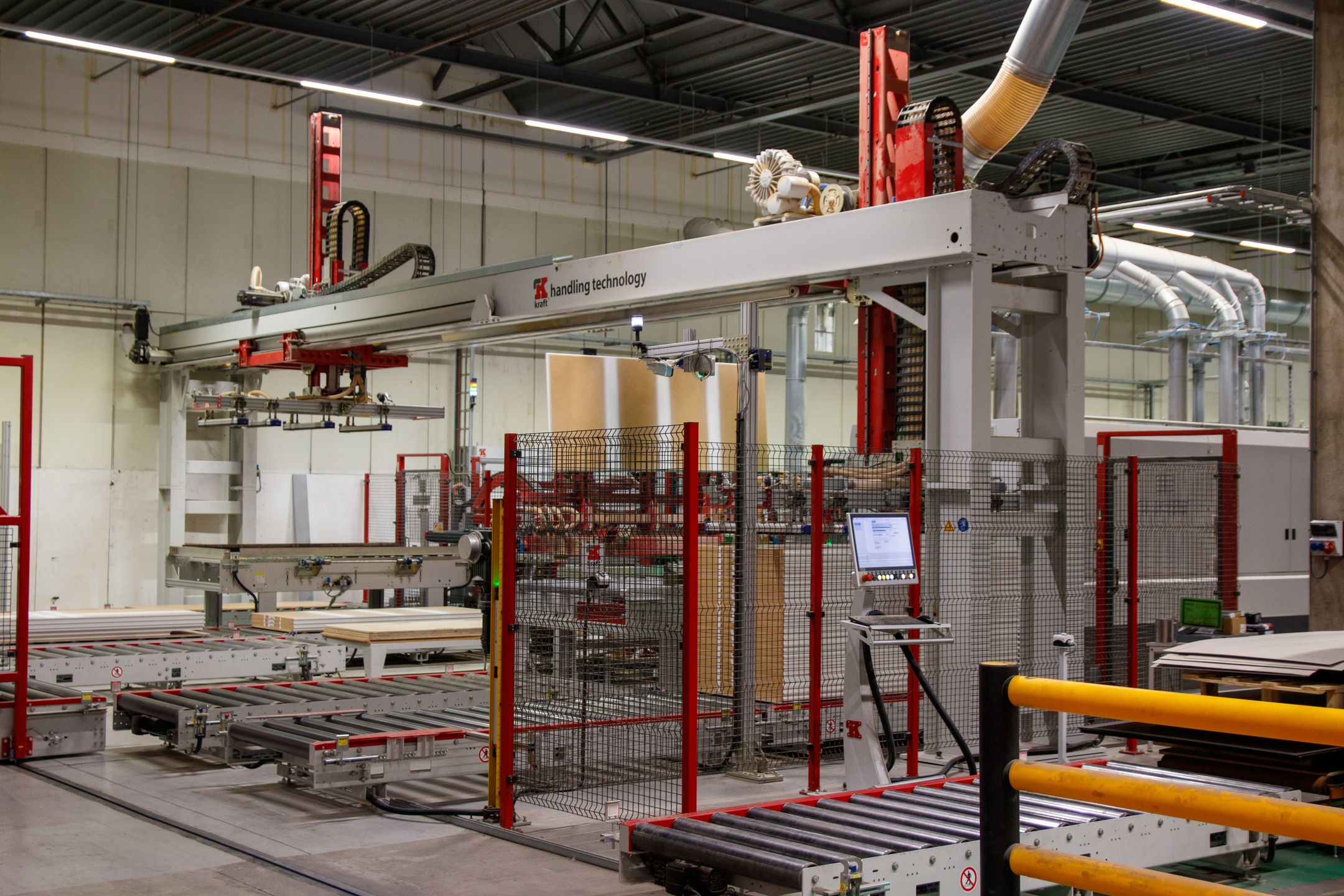 Industrial robot cell with safety guarding and a control panel