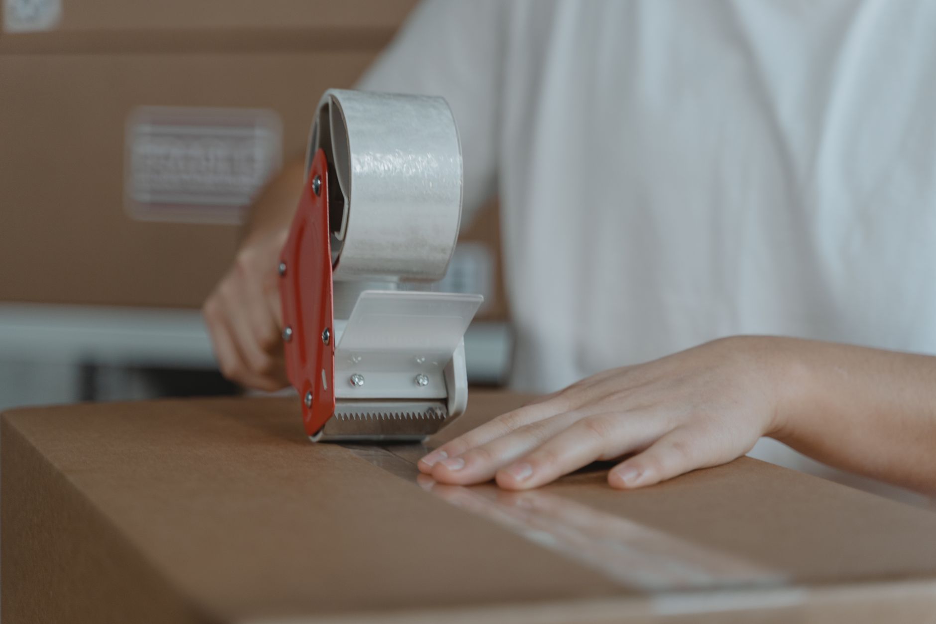Worker packaging electronic parts for shipment