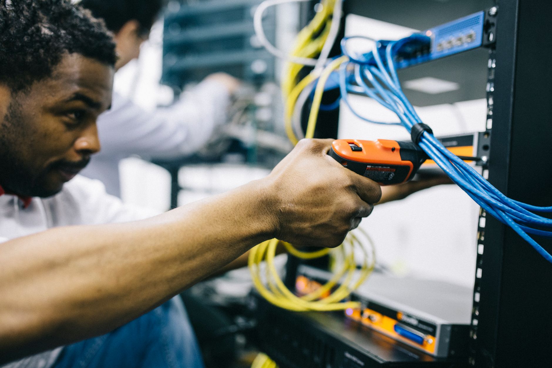 Technician securing industrial network infrastructure