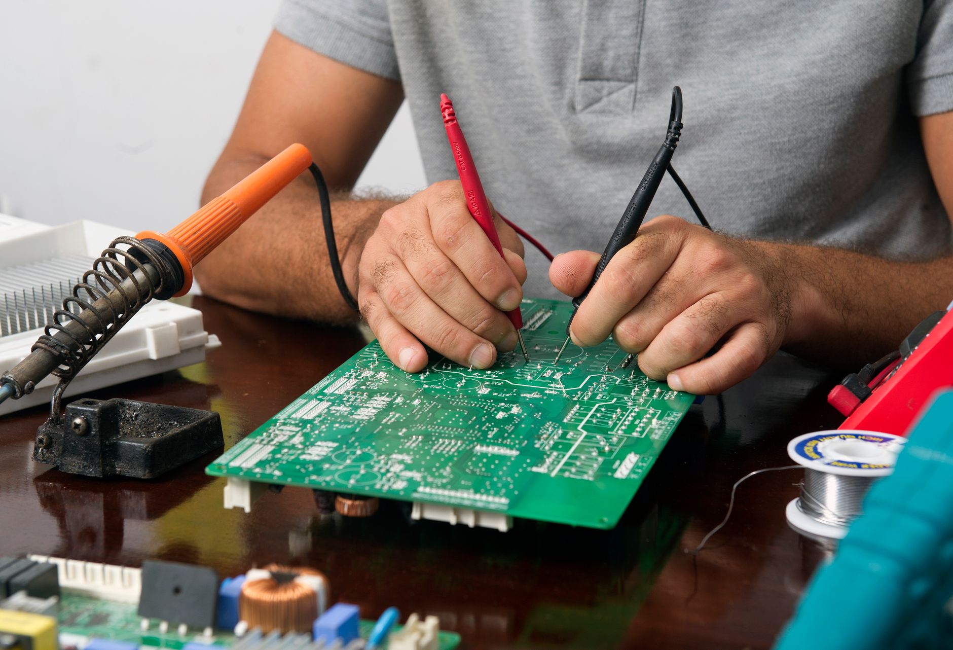 Engineer testing a photoelectric sensor beam alignment