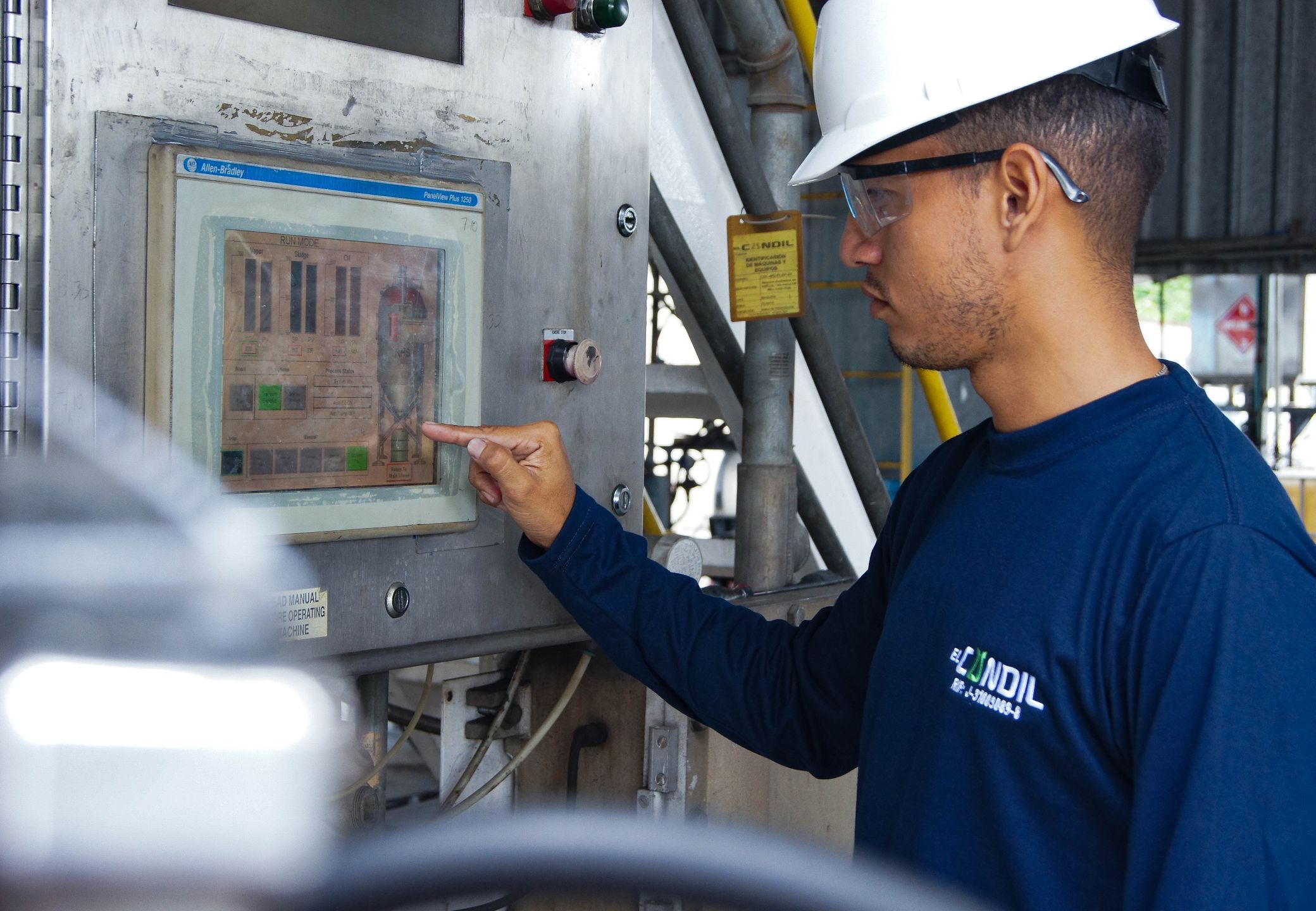 Engineer using a control panel at an industrial facility
