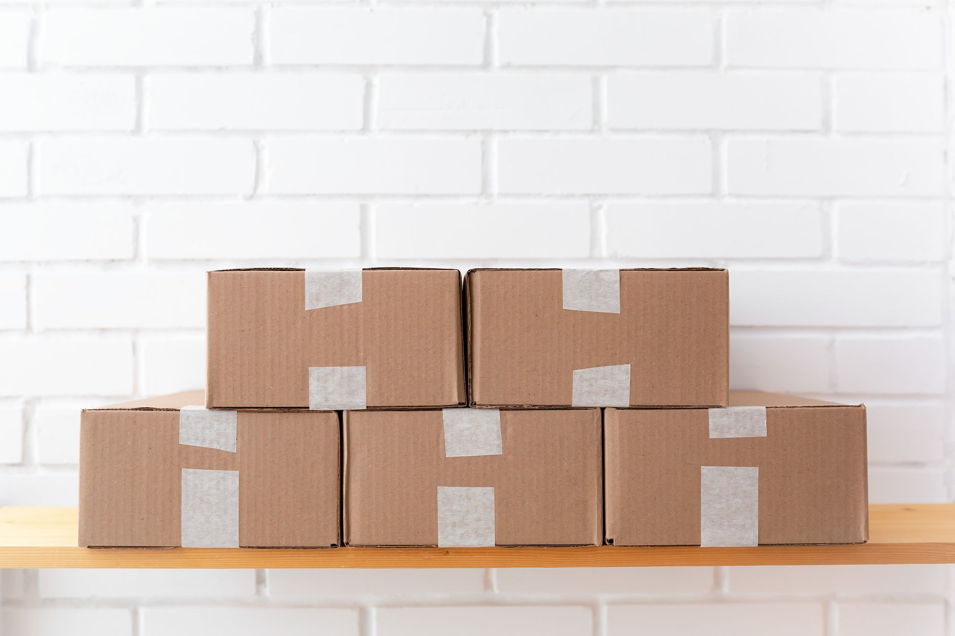 Stacked cardboard shipping boxes in a warehouse