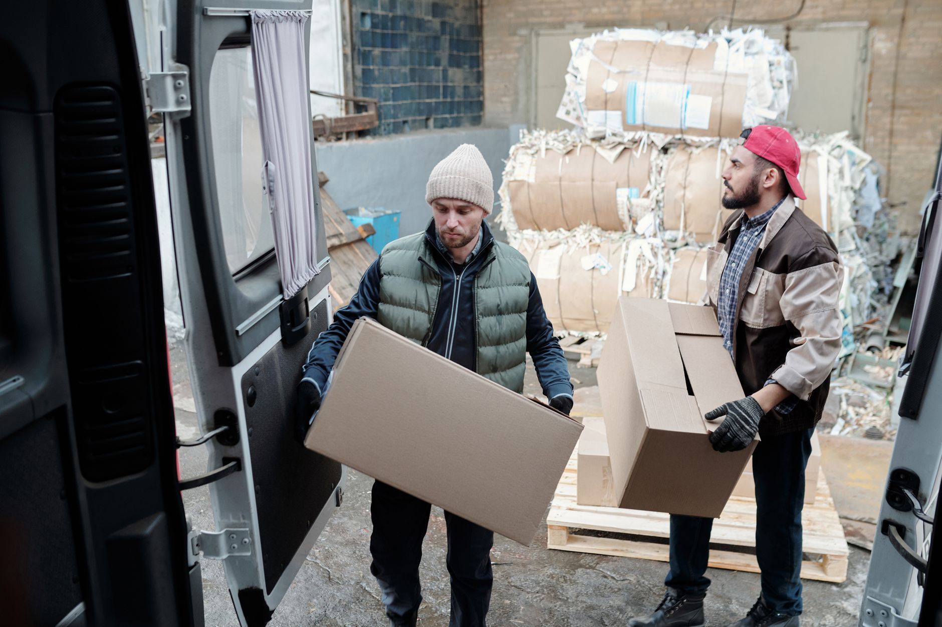 Worker sorting recyclable packaging materials