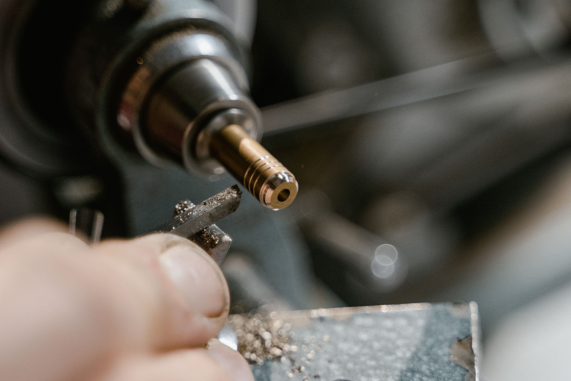 Detailed view of metalworking with a lathe in a workshop
