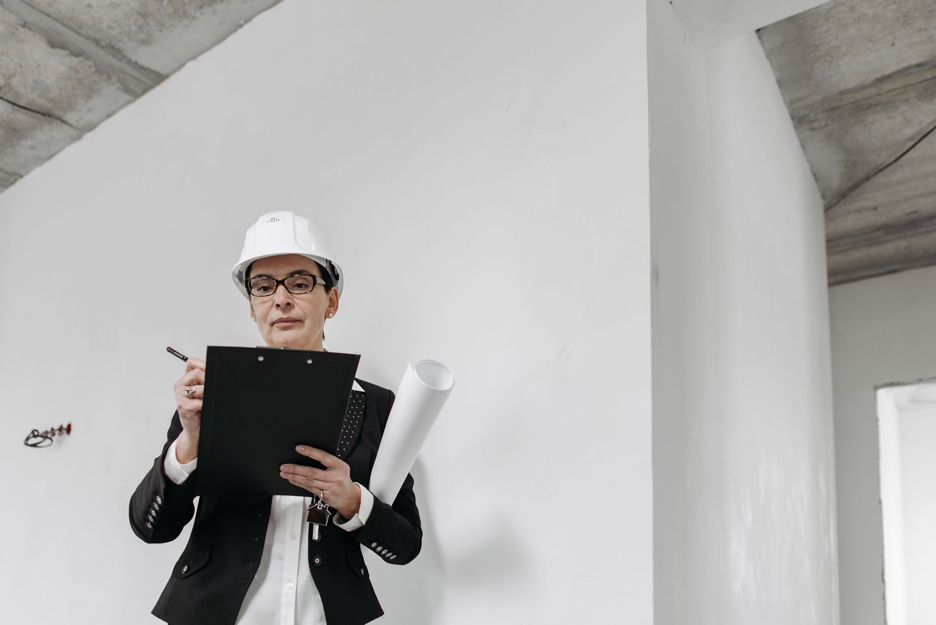 Supervisor writing a job breakdown sheet