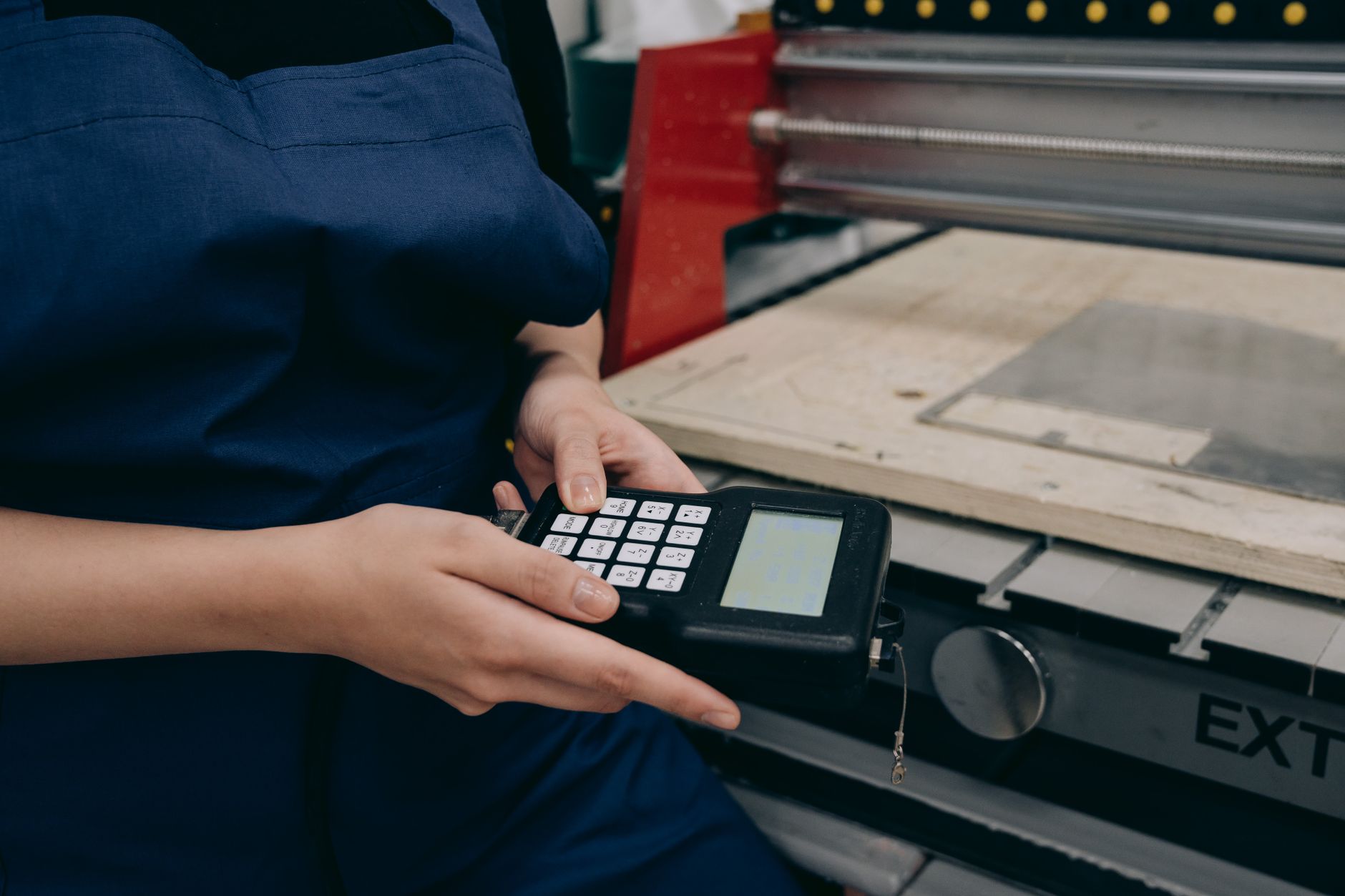 Technician programming a variable frequency drive control panel